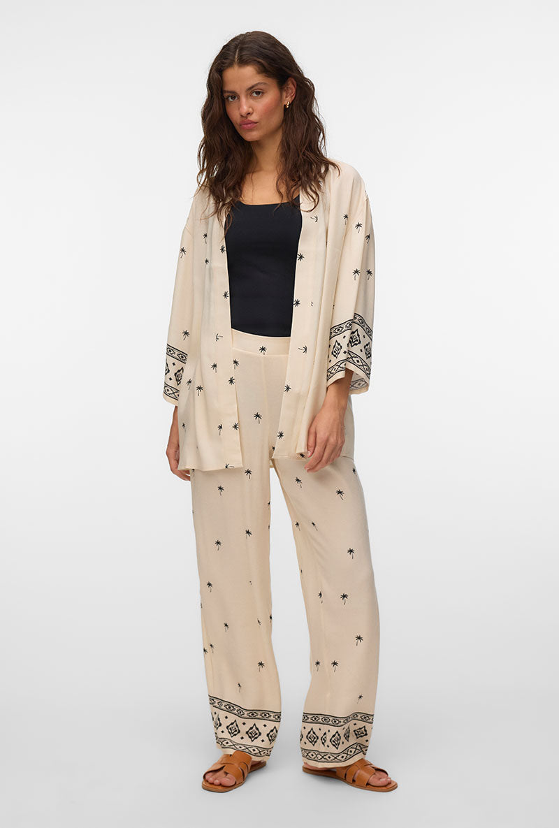 Front image of a model wearing Kai mw pants in beige, by brand Vero moda
