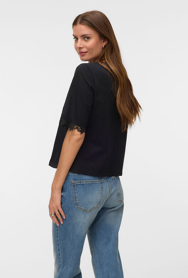 Back image of a model wearing Lyla ss oneck top in black, by brand Vero moda