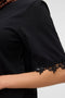 Front image of a model wearing the Lyla ss oneck top in black, by brand Vero moda