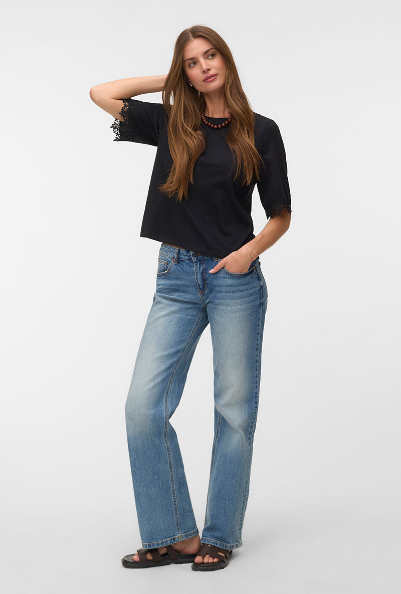 Front image of a model wearing Lyla ss oneck top in black, by brand Vero moda