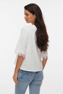 Back image of a model wearing the Lyla ss oneck top in white, by brand Vero moda