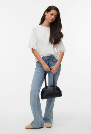 Front image of a model wearing Lyla ss oneck top in white, by brand Vero moda