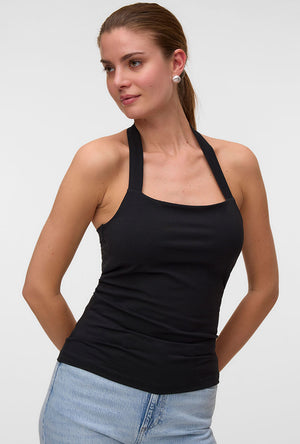 Front image of a model wearing the Valerie halterneck top in black, by brand Vero moda