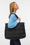 Front image of a model wearing Balloon bag in black, by brand Vero moda