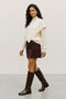 Front image of a model wearing the Camila ls cape higneck pullover in cream, by brand Vero moda