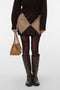 Front image of a model wearing Darla nw short skirt in chocolate, by brand Vero moda