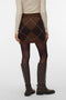 Back image of a model wearing the Darla nw short skirt in brown, by brand Vero moda