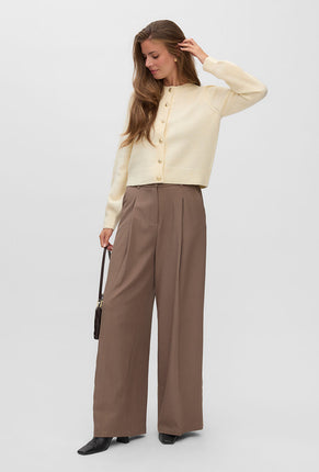 Front image of a model wearing Hazel ls oneck cardigan in cream, by brand Vero moda