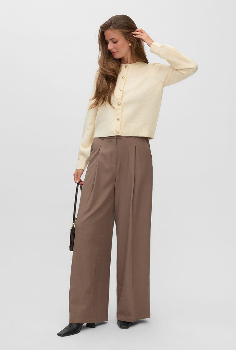 Front image of a model wearing Hazel ls oneck cardigan in cream, by brand Vero moda