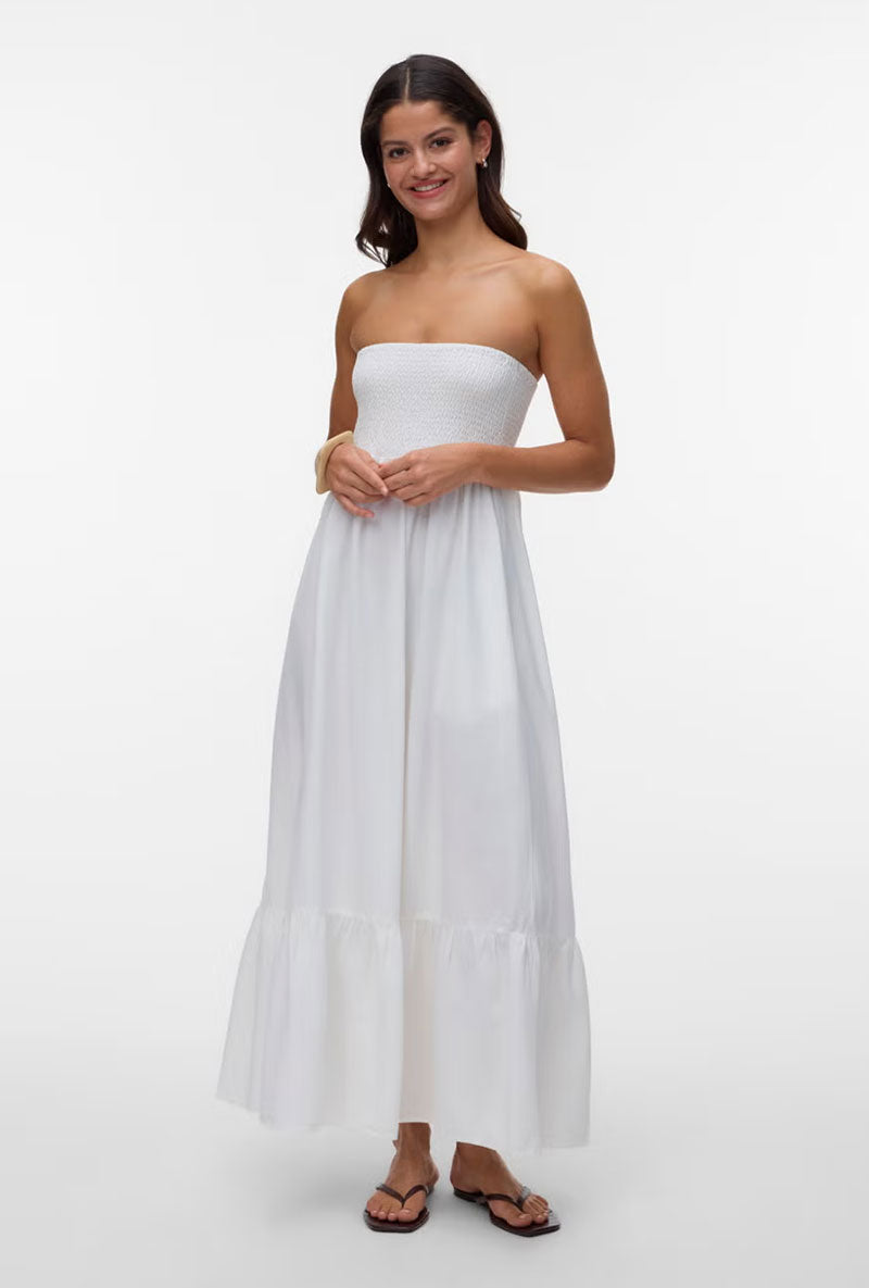 Front image of a model wearing Lisa bandeau ankle dress in off white, by brand Vero moda