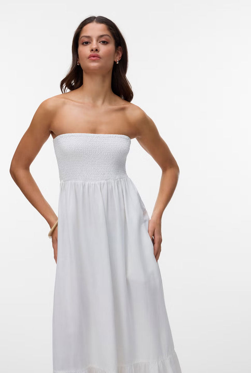 Front image of a model wearing Lisa bandeau ankle dress in off white, by brand Vero moda