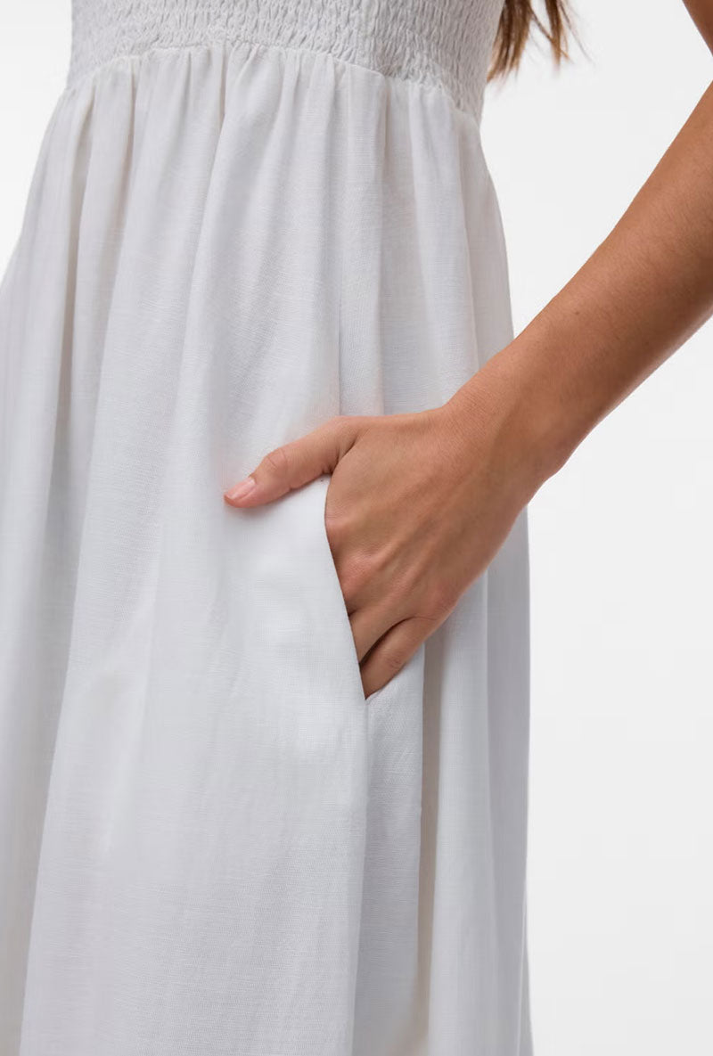 Front image of a model wearing Lisa bandeau ankle dress in off white, by brand Vero moda