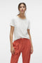 Front image of a model wearing Philipa francis ss top in off white, by brand Vero moda