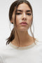 Front image of a model wearing the Philipa francis ss top in off white, by brand Vero moda