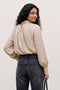 Back image of a model wearing the Sunny ls top in cream, by brand Vero moda