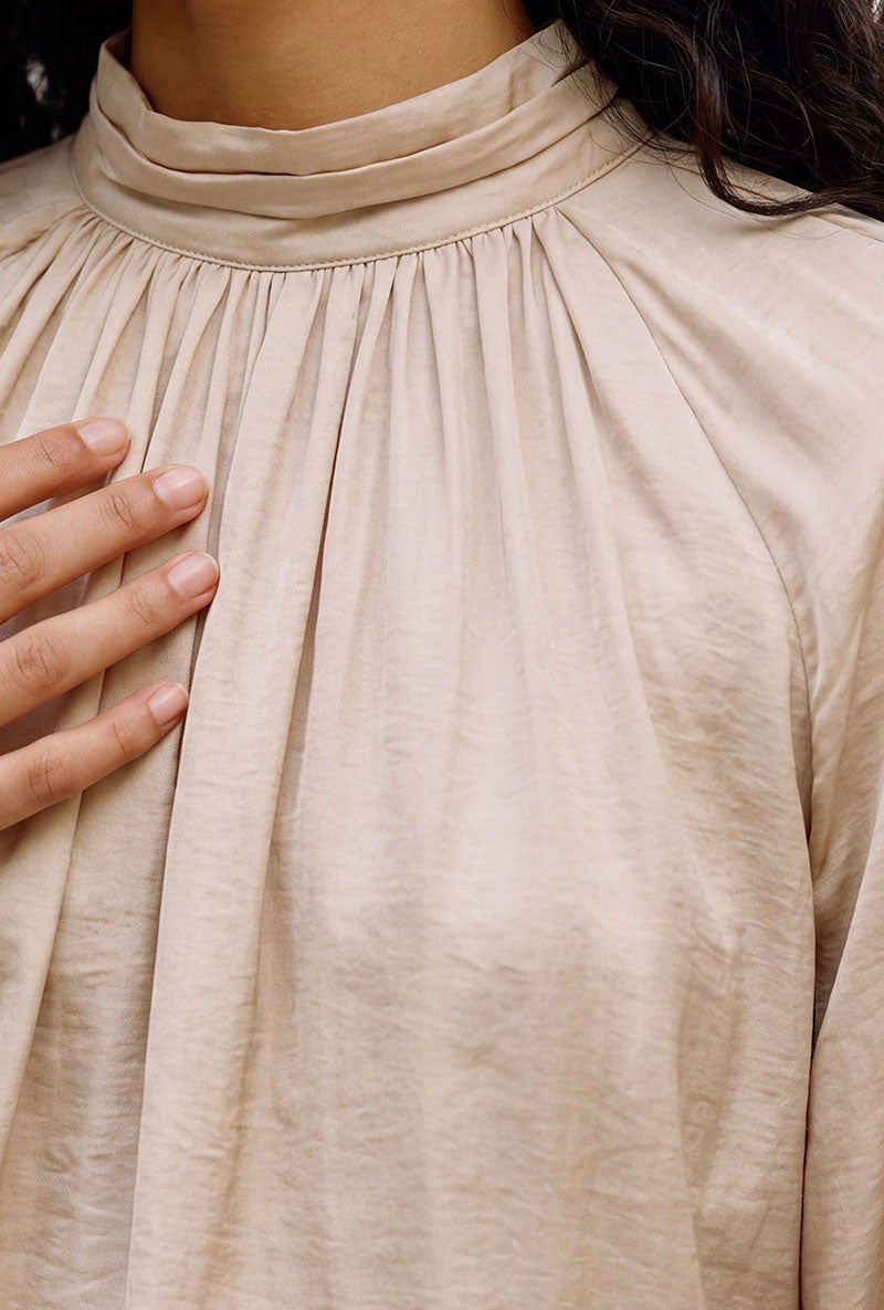 Front image of a model wearing Sunny ls top in cream, by brand Vero moda