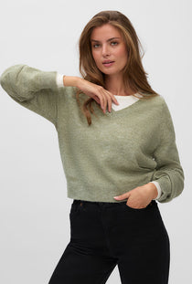 Front image of a model wearing the Teak ls vneck pullover in light green, by brand Vero moda