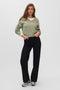 Front image of a model wearing the Teak ls vneck pullover in light green, by brand Vero moda